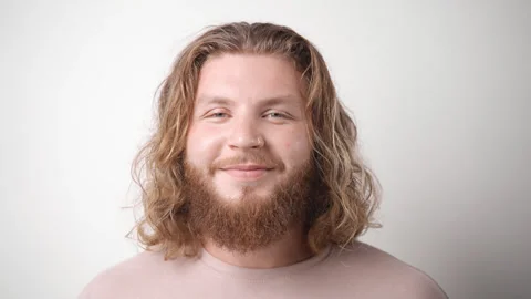 Fat red head man with long orange wave hair and beard. Happy readhead guy smile. Stock Footage 252360513
