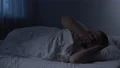 Fat sleeping man tossing in bed, health problem caused by excess weight, apnoe 4k or 4k+ Resolution