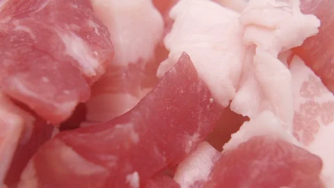 Fat slices and cubes of bacon in bowl, macro shot Stock Footage 127827336