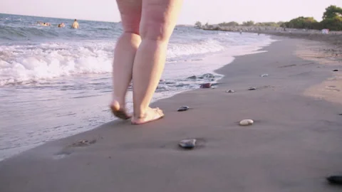 fat woman with cellulite walking on the | Stock Video | Pond5