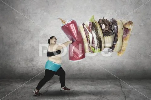 Fat woman hitting fast food Stock Photos