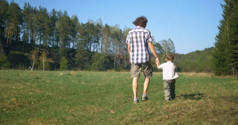 Fater and son walking Stockbeeldmateriaal 38845081