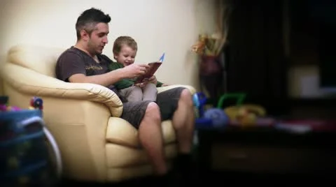 Father and Baby Boy Reading Stories Stock Footage