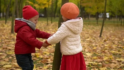 Father and children walking in the park and enjoying the beautiful autumn nature Stock Footage 164093053