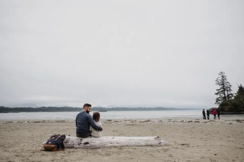 Father and daughter on beach, Tofino, Canada Stock Photos