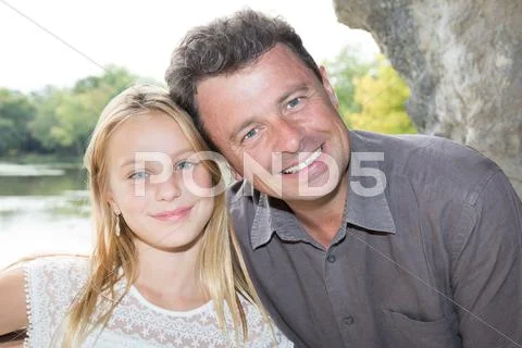 Father and daughter outside at park on summer during holidays Stock Photos