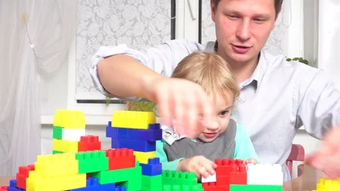 Father and daughter playing with constructor set Stock Footage 72115069