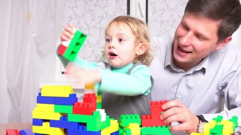 Father and daughter playing with constructor set Stock Footage 72115169