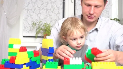 Father and daughter playing with constructor set Stock Footage 72115584