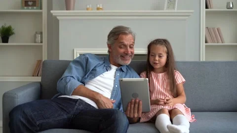 Father and daughter using digital tablet for a videocall. Stock Footage 139752006