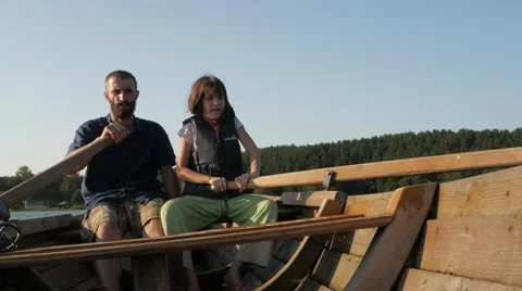 Father and Daugther Rowing Oars on the Boat.mp4 Video stock 68944796