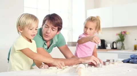 Father and his children kneading a dough Stock Footage