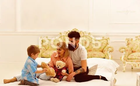 Father and mother with child play toys. happy childhood. Care and development Stock Photos