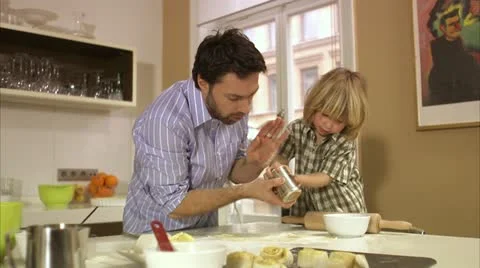 Father and son baking cinnamon buns, Stockholm Video stock 11298849