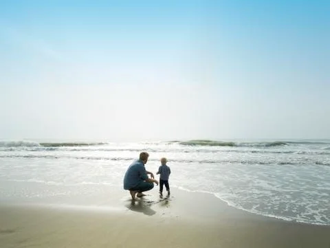Father and son on a beach day, Bajondillo Beach in Torremolinos, Stock Photos