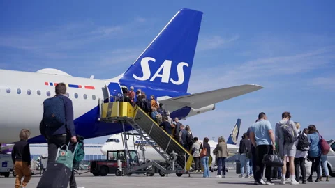 Father and Son Board SAS Airbus A321 Passenger Airplane at Copenhagen Airport Stock Footage 280274226