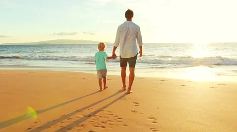 Father and Son Bonding Together at the Beach at Sunset. Stock Footage 56531433