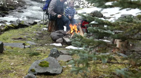 Father and son by campfire Stock Footage 61653929