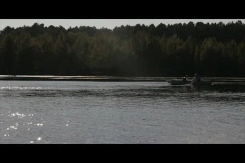 Father and Son Canoeing on Pristine Lake Stock Footage 37229556