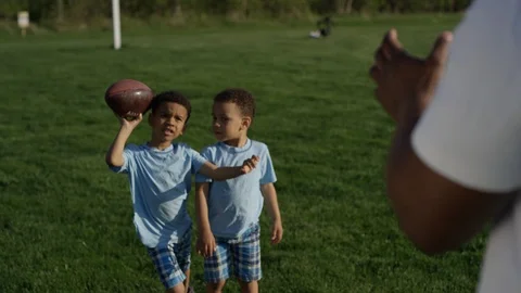 Father and son catch game with football Stock-Footage 89909611