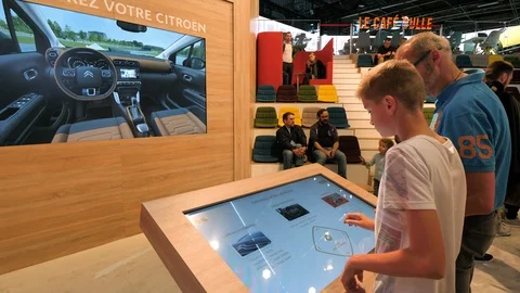 Father and son configuring their new car Stock Footage 97288906