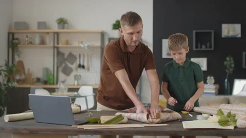 Father And Son Constructing Flying Kite Stock Footage 146402999