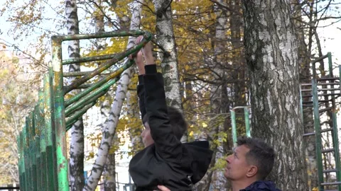 Father and son, crossfit training on playground Stock Footage 227473953