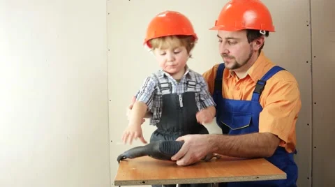 Father and son with dill turn shurup Stock Footage 59130632