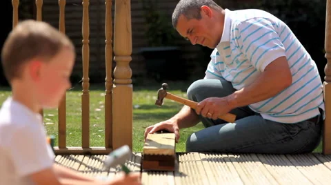 Father and son DIY rack focus, Stockbeeldmateriaal 42804213