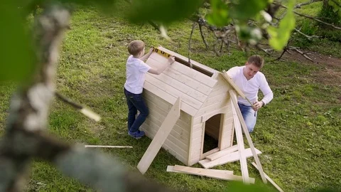 Father and son do carpentry in slow motion Stock Footage 82742730