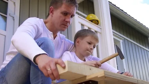 Father and son do carpentry Stock Footage 82742799