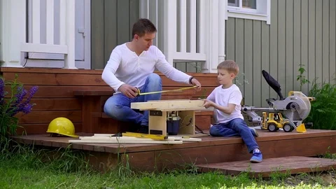 Father and son do carpentry Stock Footage 82743418