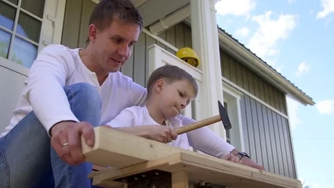 Father and son do carpentry Stock Footage 82743435