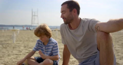 Father And Son Enjoying Their Time At The Beach Stock Footage 144181702