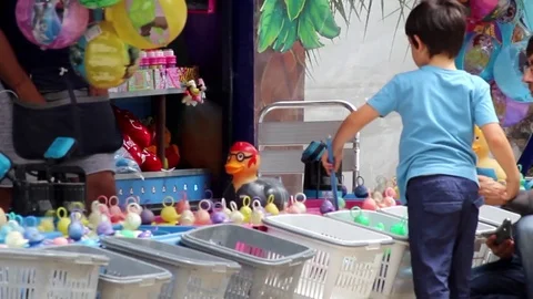 Father and son at a fairground Stock Footage 78486780