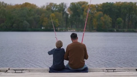 Father and son fish on the lake Stock Footage 80842677