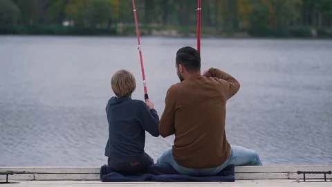 Father and son fish on the lake Stock Footage 80842772