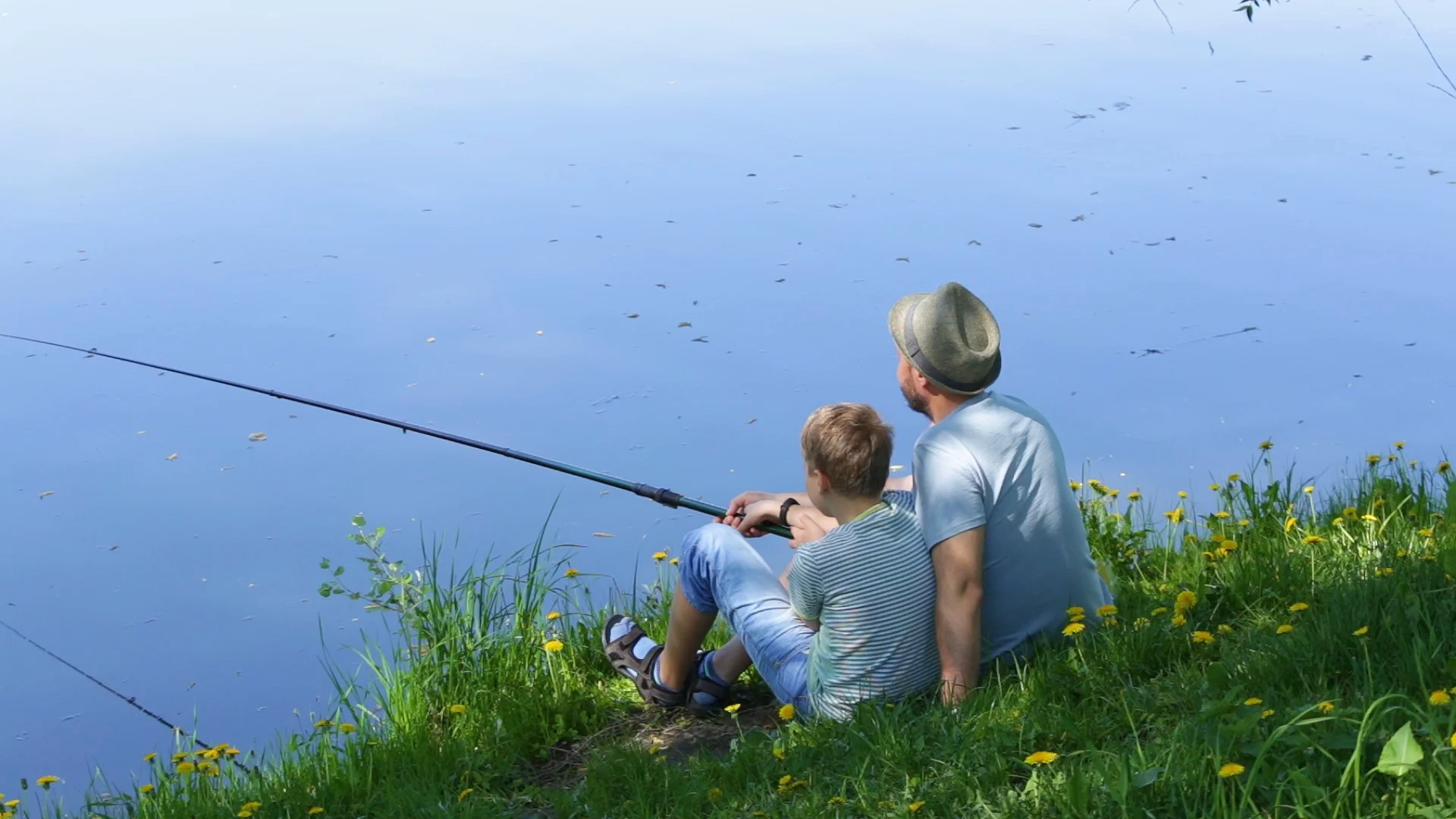 Father and son fishing together