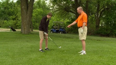 Father and Son Golfing Stock Footage 74236477