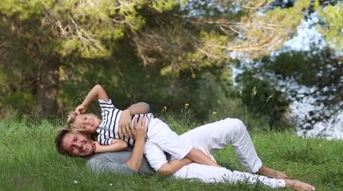 Father and son having fun in the meadow Stock Footage 57380101