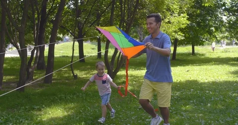 Father and son having fun in park Stock Footage 114837817