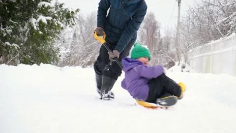 Father and son having fun on winter while shoveling fresh snow after snowstorm. Stock Footage 167373851