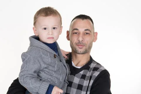 Father and son looking at the camera on white Stock Photos