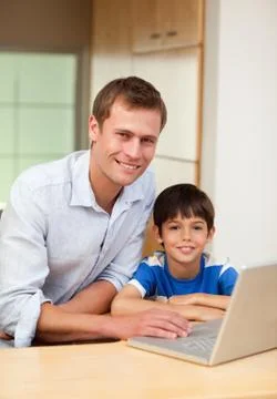 Father and son with notebook Stock Photos