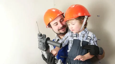 Father and son with one drill. Stock Footage 58953180