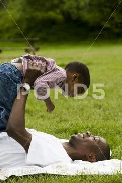 Father And Son Outside Playing