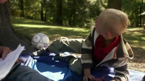 Father and son in a park a sunny day Stock Footage