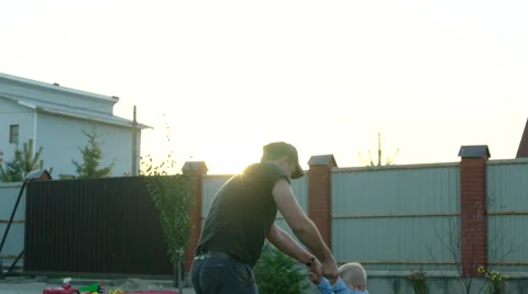 Father and Son Playing on the Backyard Stock Footage 56255000