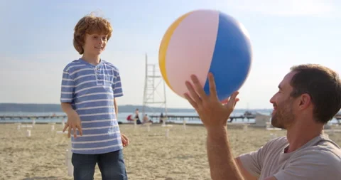 Father And Son Playing With Beach Ball Stock Footage 144263512