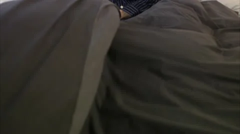 Father and son playing in a bed Stock Footage 11292112